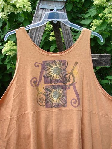 1994 Short Simple Smock Double Daisy Oro Size 1, featuring two stylized sunflowers with curlicue lines and partial guitar motifs, hangs on a clear hanger. A loose, flowing design with sectional panels and rounded neckline.