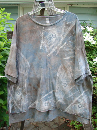 Barclay Raw Edge Flutter Collar High Low Top in Wind Storm Mottled Grey Night features a rounded flutter neckline, short dolman sleeves, boxy shape, and raw-edged hi-low hemline, embodying BlueFishFinder's vintage style.