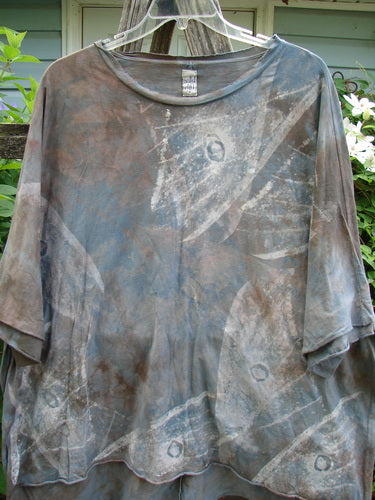Barclay Raw Edge Flutter Collar High Low Top Wind Storm Mottled Grey Night OSFA featuring a rounded batiste flutter neckline, short raw edge dolman sleeves, and a wide boxy shape with a raw-edged hi-low hemline.