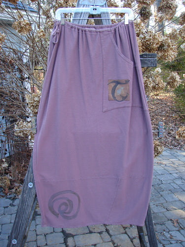 2000 Crepe Rennai Lindrel Duo Loam Size 2: Purple skirt with pocket and matching jacket, featuring unique ties, pointed hem, and gathered cuffs.