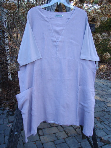 Barclay Linen Cotton Sleeve Triangle Dress on clothesline, with empire waist seam, double drop side pockets, and longer cotton sleeves. Size 2.