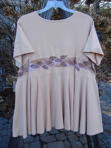 1997 Ocean Pearl Dress with leaf band, size 2: A tan shirt with purple leaves, a close-up of a dress, a white cloth, a close-up of a metal object, a blurry image of a tree, and a close-up of a leaf.