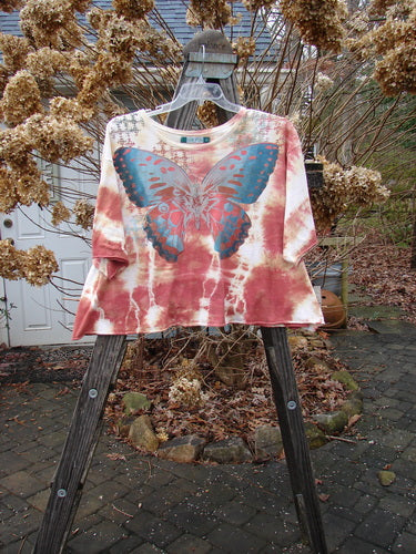Barclay Three Quarter Sleeved Crop A Lined Tee with butterfly motif, in mottled sunset, size 2.