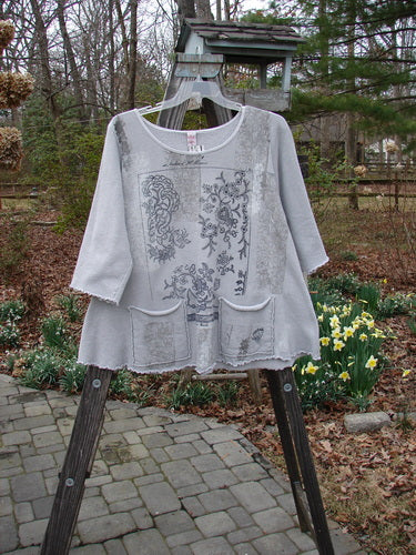 Barclay NWT Fleece Cafe Sweatshirt with Wonder Garden design on rack.