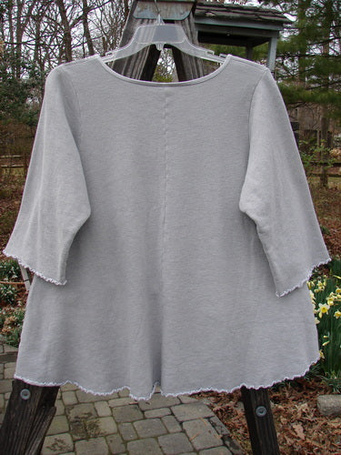Barclay NWT Fleece Cafe Sweatshirt with wider sleeves and flared hemline on a person outdoors.