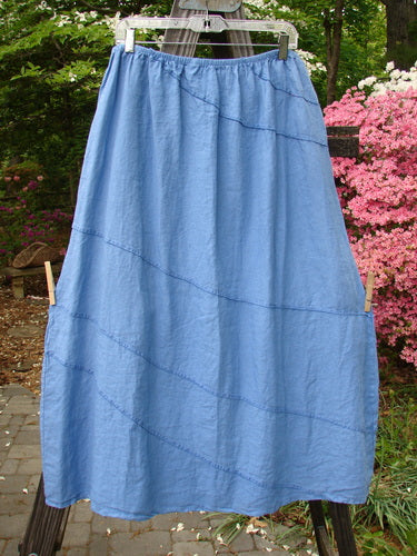 A Barclay Linen Diagonal Skirt, size 2, in Skylark. Unpainted and in perfect condition. Features exterior diagonal stitchery, a slightly shorter boxier length, and shape. Full cotton waist relaxed 32, waist extended 42, hips 60, and length 38 inches.