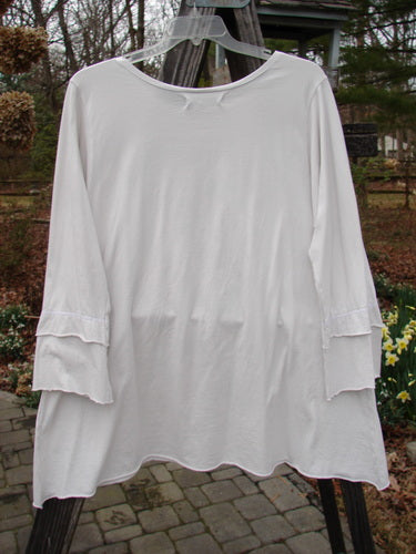 Barclay NWT Petal Sleeve A Line Tunic on clothes rack, garden visit theme, organic cotton, size 1.