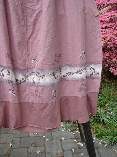 Barclay Linen Duet Skirt Falling Fern Dried Rose Size 2: A pink dress with a floral design, featuring a seriously widening bell shape, sectional panels, and a varying hemline.