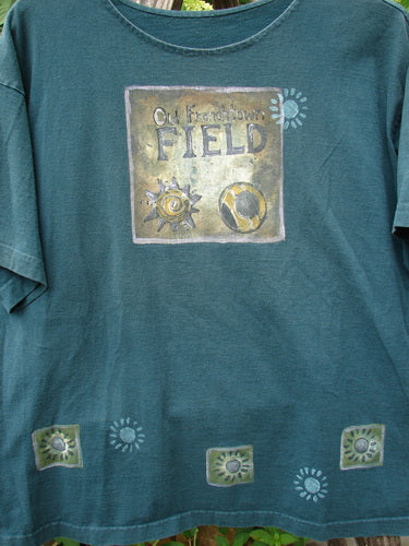 1996 Short Sleeved Promo Tee Old Frenchtown Field Viridian Size 1 features a hand-printed design with sun motifs and a square panel. The forest-green tee showcases Blue Fish's creative, vintage style.