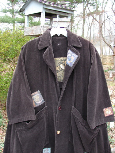 Vintage coat with pockets on a swing, outdoor scene.