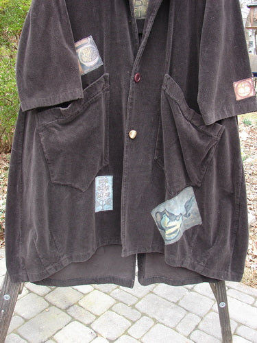 1998 Patched Tapestry Coat with unique patches and textures, close-up details of fabric and stitching.
