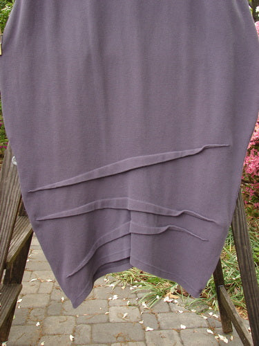 2000 NWT Awen Skirt, Eggplant, Size 2. Heavy cotton thermal with elastic waistband. Generous bell shape, textured diagonal hemline.