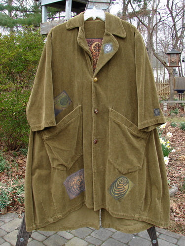 Vintage 1998 Patched Tapestry Coat on a swinger, forest path glazed tile, with pockets.