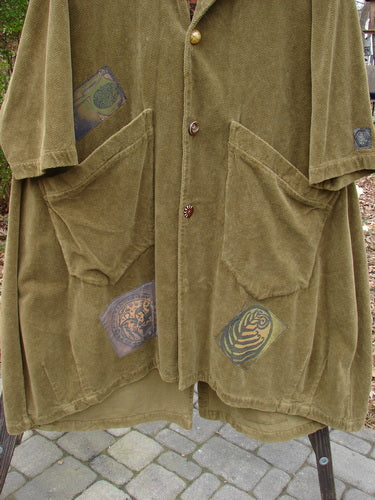Vintage forest path coat with logo, pockets, and tapestry patches.