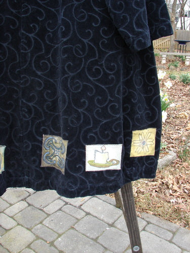 1999 Patched Poet's Coat with unique design, close-up details, and candle holder.