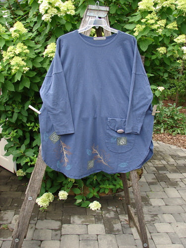 1996 Long Sleeved Pop Top Fall Leaves Niagara OSFA featuring a loose-cut design, oversized front pocket with textured button, and signature leaf prints near the hem, displayed on a hanger over a ladder.