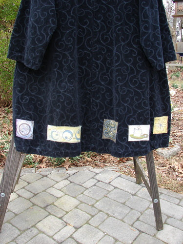 Patched Poet's Coat with unique designs, wood and stone details.