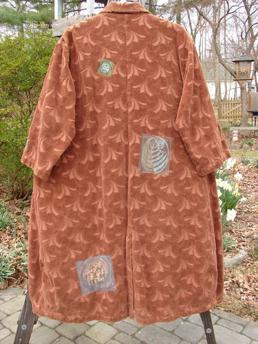 Vintage 1998 Patched Tapestry Coat with unique designs, perfect for expressing individuality.