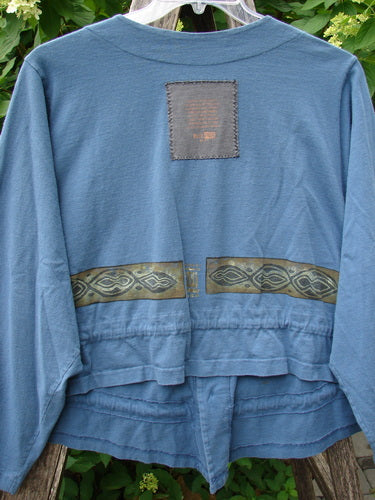 1997 Treehouse Jacket Greek Column Blueprint Size 2 features a back patch, Celtic-style decorative bands, and a flounced hem. It's a lightweight, artisan piece in mid-weight organic cotton from Bluefishfinder.com.