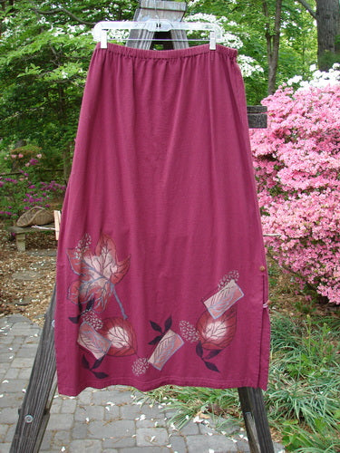 Barclay Panel Nut Button Vented Skirt Oakleaf Madder Size 2: A straight skirt with tall vented sides, nut-like buttons, and a leaf theme paint all around the hemline.