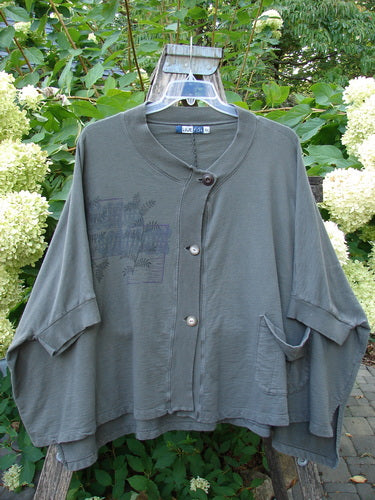 Barclay Slub Dolman Shirttail Pocket Jacket Fern Green Army Size 0 displayed on a wooden hanger. Features include a button-front, ribbed collar, dolman sleeves, shirttail hemline, and distinctive slub texture.