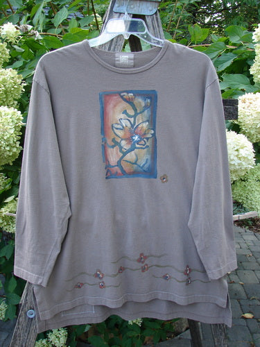 1999 Long Sleeved Vented Tee Orchid Sprig Shale Size 1 features a painterly flowering branch motif on a taupe background, ribbed neckline, sweet vented sides, and embroidered flowers at the hem.
