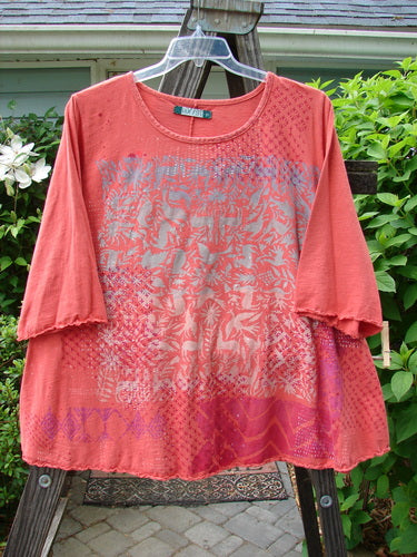 Image alt text: "Barclay Three Quarter Sleeved Textured A Lined Tee Top, featuring a red shirt with a pattern on a clothes hanger"