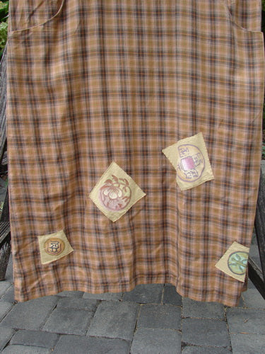 1999 Patched Overall Jumper Mixed Far Eastern Gold Plaid Size 2 draped over a wooden chair, showcasing abstract appliqué patches in muted tones, emphasizing its vintage and unique design from Bluefishfinder.com's collection.