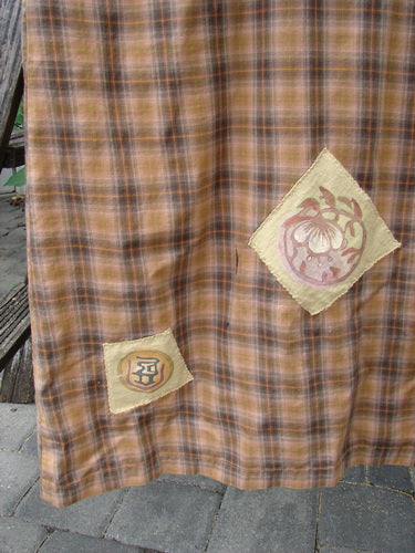 1999 Patched Overall Jumper Mixed Far Eastern Gold Plaid Size 2 drapes elegantly, showcasing floral and character appliqué patches, front pocket bib, and unique button stays, embodying Bluefishfinder.com’s vintage charm and creative freedom.