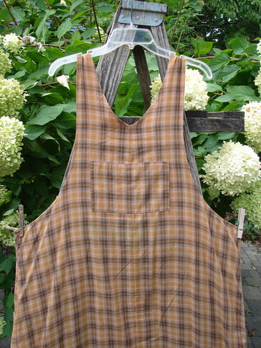 1999 Patched Overall Jumper Mixed Far Eastern Gold Plaid Size 2 displayed outdoors, featuring a deep scoop neckline, front patch pocket, and clipped to dry, aligned with Bluefishfinder.com's unique vintage style.