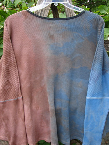 Barclay NWT Thermal Crop Top Finch Mottled Bibbi Blue OSFA displayed outdoors on a hanger, featuring a unique hand-dyed two-tone effect, scooped neckline, and waffle texture, reflecting BlueFishFinder's vintage-inspired creativity.