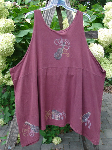 1994 Short Simple Smock Magic Music Beet Size 2, features a loose-fitting, sleeveless design with stylized musical instrument motifs on the front, hung outdoors, highlighting its unique shape and sectional panels.