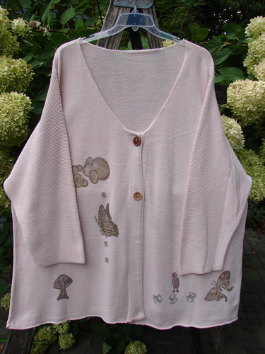 1994 2 Button Cardigan Sweater Magical Garden Pink Granite OSFA, featuring a loose fit, deep V-neck, and enchanting motifs of mushrooms, butterflies, and clouds, with two distinctive wooden buttons.