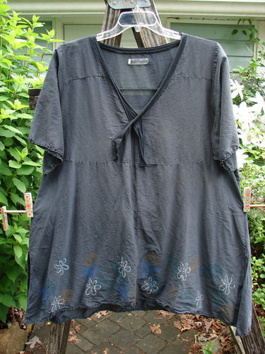 Barclay Batiste Deep Neck Sailor Tie Tunic Daisy Black Size 2 features a deeper V-shaped neckline, widening hemline with raw edges, tiny vented sides, and horizontal shoulder panels, exuding a vintage flair.