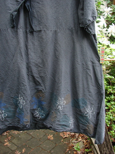 Barclay Batiste Deep Neck Sailor Tie Tunic Daisy Black Size 2 with a deep V-neck, widening hemline, raw edges, and daisy theme, reflecting Bluefishfinder.com’s vintage-inspired, creatively expressive style.