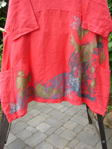 Barclay Linen Cross Over Dress in Geranium, Size 2: A red shirt with a design on it. Textile clothing with a pattern.