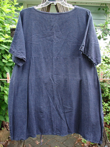 Barclay Hemp Vented Drawcord Dress Moon Night Denim Size 1, featuring a rounded neckline, kangaroo pocket, curved empire waist, vertical drawcord, sectional panels, painted wide sleeves, and vented sides, embodying Blue Fish Clothing's creative freedom.