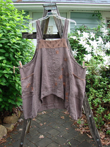 Barclay Linen Adjustable Snap Apron Jumper Playful Chirp Mocha Size 2 features adjustable straps, dual pockets, and a playful birdie design, showcasing versatile style and individuality synonymous with Bluefishfinder.com.