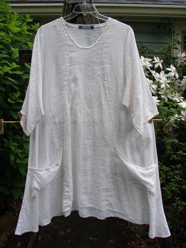 Barclay Linen Side Pocket Tab Tunic Dress Unpainted White Size 2, featuring a scoop neckline, elastic rear tab, S-shaped seams, wide sleeves, and two drop pockets, reflecting BlueFishFinder's vintage elegance.
