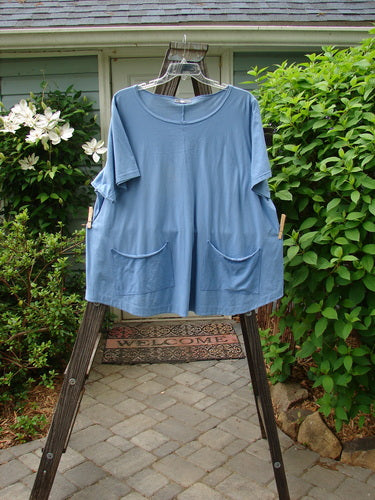 Image alt text: Barclay Double Pocket Twinkle Top Unpainted Sky Size 2 on a clothes rack with exterior pockets.