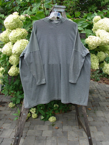 1999 Cotton Lycra Square Mock Pullover Unpainted Black Stripe Size 2, displayed on a hanger, features a boxy shape and dolman sleeves, embodying vintage Blue Fish Clothing's creative and inclusive spirit.