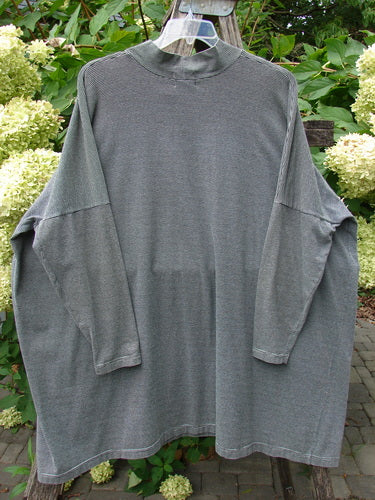 1999 Cotton Lycra Square Mock Pullover Unpainted Black Stripe Size 2, showcased outdoors, featuring a long-sleeved oversized design with a mock turtleneck and dolman drop shoulders, hanging against a natural backdrop.