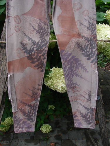 Barclay NWT Cotton Lycra Side Gather Drawcord Legging Forest Moon Oriel Size 1, showcasing abstract fern-inspired print, draped over a rustic ladder amid hydrangeas, embodying BlueFishFinder's vintage creative expression.