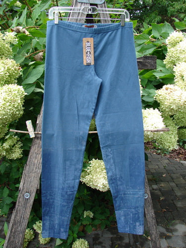 Barclay NWT Cotton Lycra Legging Light Scribe Echo Blue Size 1, hanging outdoors, showcasing its slim-fit design. Features a full elastic waistband and tapering lowers, perfect for expressing individuality.