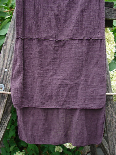 Barclay Gauze Sectional Scarf Wrap Unpainted Deep Burgundy OSFA elegantly draped on a rustic ladder, showcasing its loosely woven texture and sweet finished edges, embodying BlueFishFinder's vintage elegance.