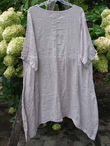 Barclay NWT Linen Wave Pocket Dress, showcasing a long-line, kaftan-style silhouette in muted gray/taupe, with elbow-length sleeves, scooped neckline, visible front seams, and side slits, embodying Bluefishfinder.com's vintage spirit.