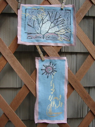 A pair of fabric art banners featuring the PMU 1997 Summer Sun and Forest Patch Set on a wooden lattice.