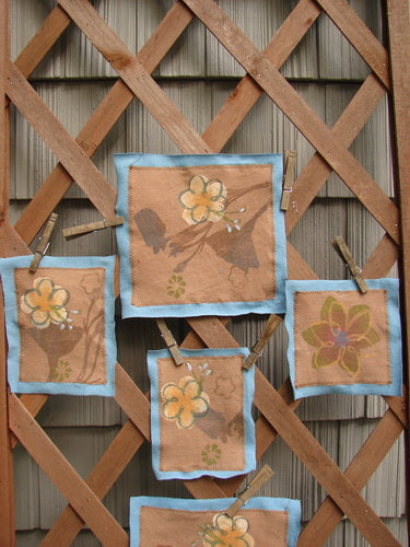 Image alt text: A group of fabric squares with flowers on them from the PMU 2000 Spring Floral Patch Set.