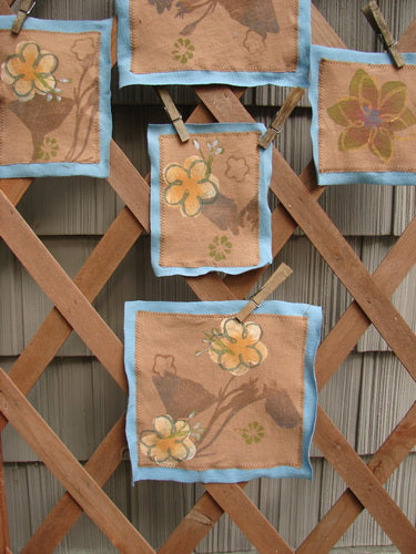 Image alt text: "The PMU 2000 Spring Floral Patch Set - a wooden lattice with cloths featuring flowers, part of the Bluefishfinder.com Vintage Blue Fish Clothing collection."