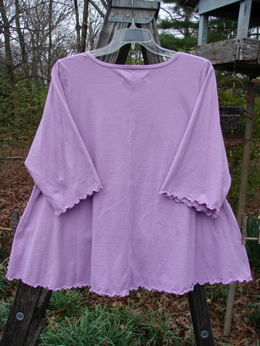 Barclay Three Quarter Sleeved Crop A Lined Tee Sun Guy Mottled Peony Size 1 displayed on a hanger, showcasing its A-line shape, rounded neckline, and sweet curly edgings.